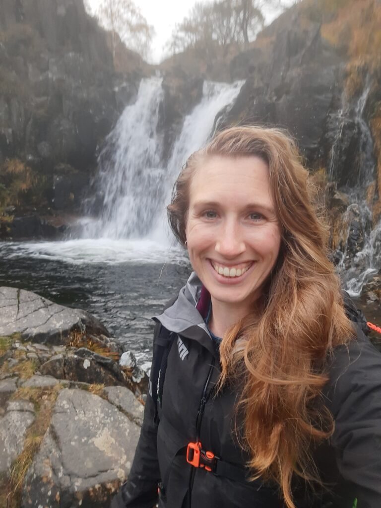Woman in front of a waterfall in N Wales